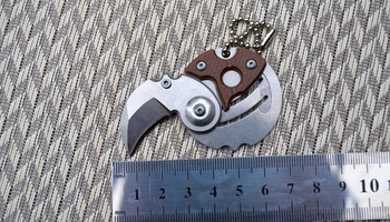 Нож-монета Serge Panchenko Coin Claw brown